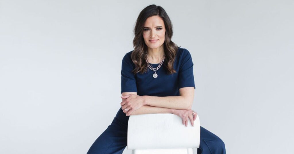 Dr. Christine Maren sitting and smiling directly at the camera