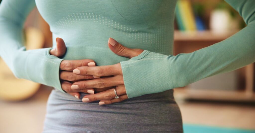 A woman holding her stomach